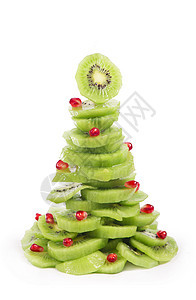 圣诞树果色沙拉 带有kiwi和石榴 浆果 食物背景图片