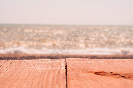 抽象自然夏季或春季海洋背景 金色温暖水面上的小波浪在运动中模糊 日落时的散景灯 和娱乐背景概念 金的 旅行图片