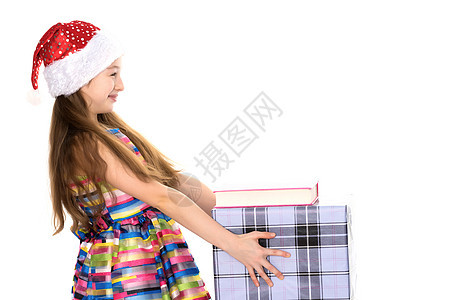 一个带着圣诞老人帽子的礼物的小姑娘 童年 微笑图片