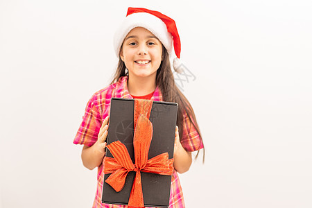 带着圣诞礼物盒的快乐笑笑小女孩 庆典 脸图片