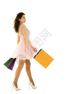年轻女孩在商店里买东西 有大纸袋 购物狂 购物图片