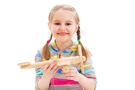 玩木玩具飞机的笑笑女孩 可爱的 孩子 飞行 未来图片
