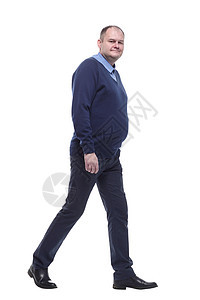 身穿蓝色跳跃器的成熟男子 前行曲折 购物 裤子图片