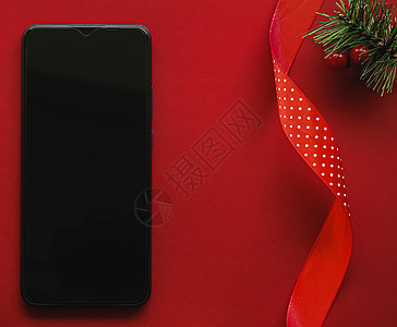 带有空白黑屏幕的智能手机和红色背景的Xma装饰 作为平板假造模型设计 c 用于使用普通 假期 电话图片