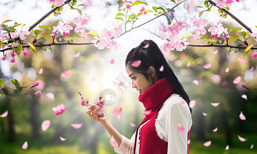 花瓣雨桃花树下的少女设计图片