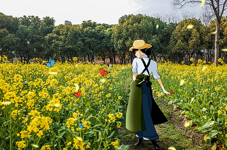 油菜花中的女孩背景图片