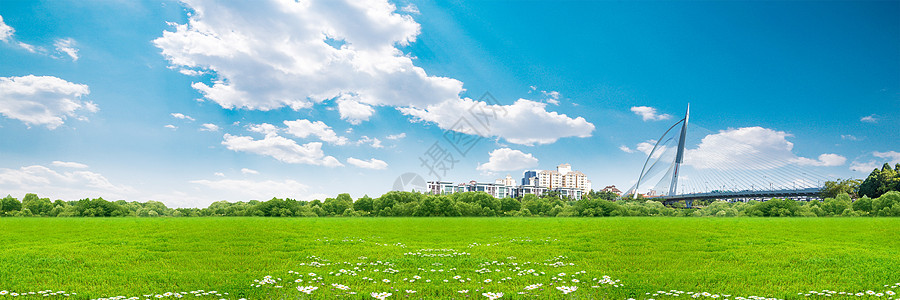 天空草地城市背景图片