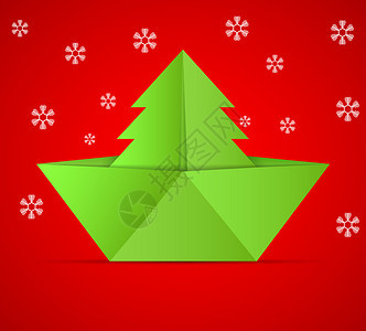 圣诞树和折纸船的概念图片