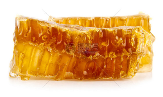 蜂蜜在白色背景上的蜂窝图片