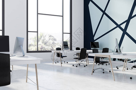 蓝色和黑色的开放空间办公室内部有混凝土地板白色和木桌黑色椅子和带空白屏幕的电脑侧面图3图片