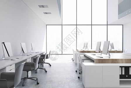 白开放办公用房内白色木制桌和两排电脑图片
