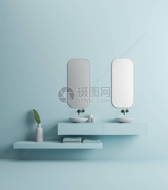 两个优雅的浴室水槽站在蓝色架子上两个垂直的镜子挂在他们上方蓝色墙壁浴室内部图片