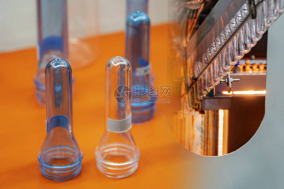 饮料厂制造过程加热器中塑料瓶坯形状的抽象场景饮用图片