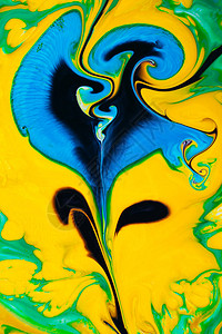用黄色绿色和蓝色丙烯酸涂料的抽象彩色背景图片