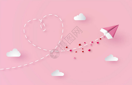 情人节的概念纸上飞机在空中飞翔图片