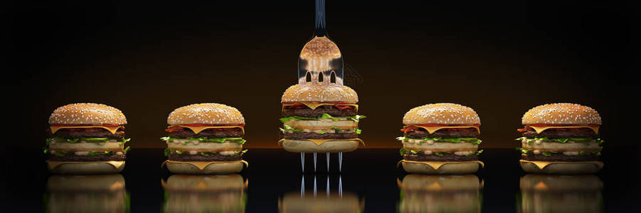 一小块汉堡包卡在叉子上足够营养的图片