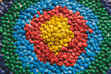 工业彩色聚合物染料塑料颗粒塑料着色剂塑料聚乙烯颗粒背景背景图片