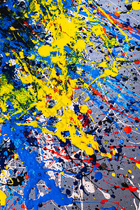 抽象表现主义当代艺术使用滴水技术绘制的图片混合不同的颜色红黄蓝白黑色彩缤纷线条和斑图片