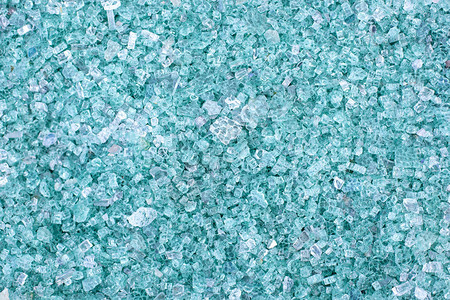 蓝色玻璃碎片碎玻璃的小而锋利的碎片用于制造新玻璃的碎玻璃已准备好重新熔化大量的碎玻璃颗粒垃圾回收图片