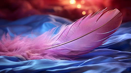 落在蓝色绸缎上的一根粉色羽毛背景图片