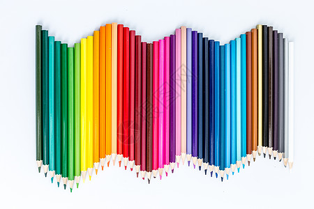 绘制彩虹教育设计铅笔平铺波浪形拍摄背景