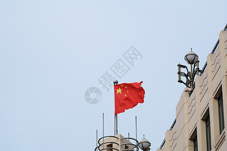 国庆上海城市国旗飘扬背景图片