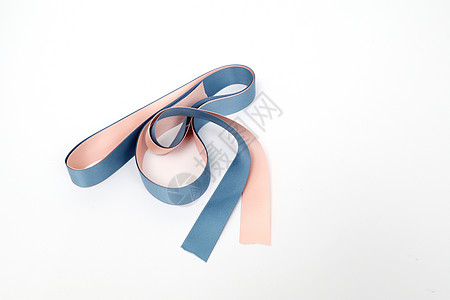 金色拉花粉色蓝色丝绸缎带包装素材背景