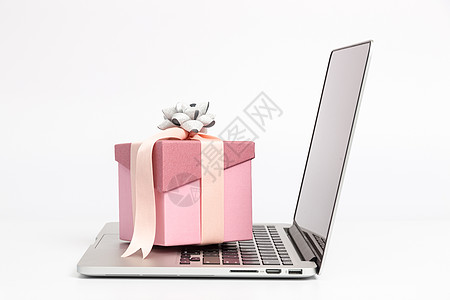 粉色礼物盒笔记本电脑背景图片