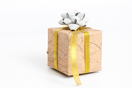 礼物包装纸金黄色缎带白色背景礼盒背景