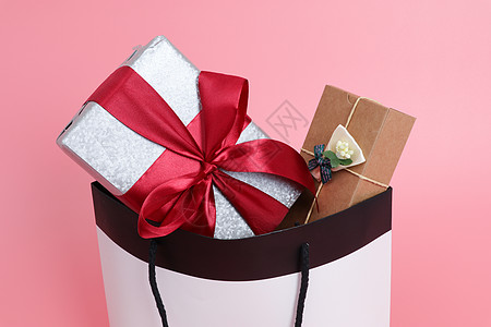 韩式蝴蝶结装满礼物的购物袋背景