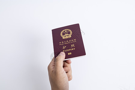 白色底色手拿护照证件背景