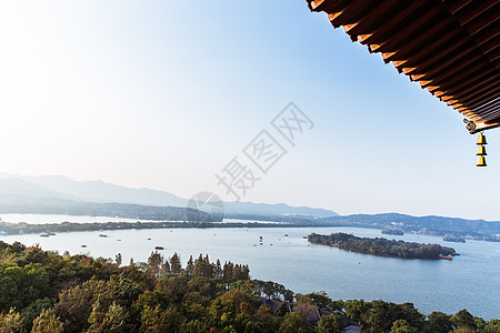 城市丛林杭州西湖龙头屋檐湖中岛背景