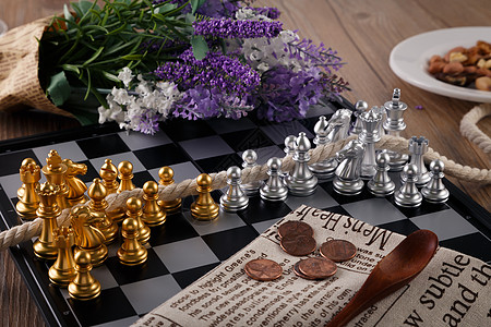 国际象棋的两队棋子拔河背景图片