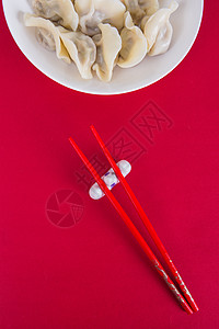 节日喜庆背景中国冬至简洁红色喜庆背景的热饺子背景
