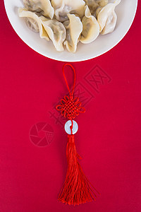 中国冬至简洁红色喜庆背景的热饺子图片