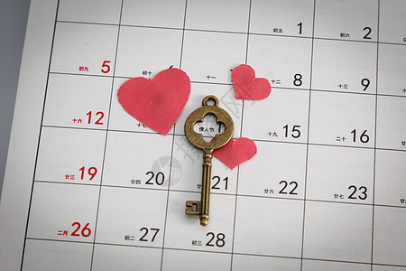 情人节日历爱心钥匙在白色背景上图片