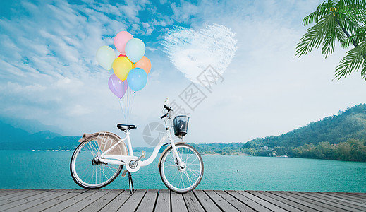 折叠自行车海边带着气球的自行车设计图片