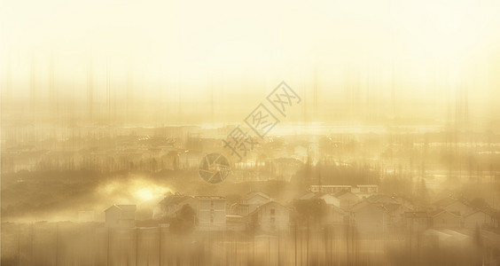 阳光下晨雾中的村庄图片