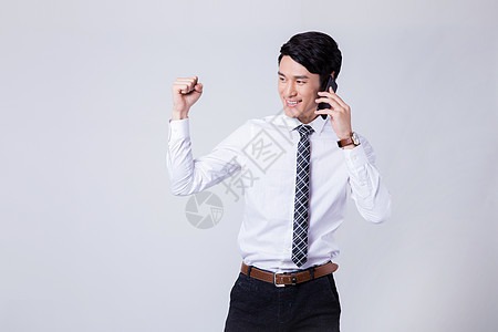 电话谈判胜利的商务男士半身像图片