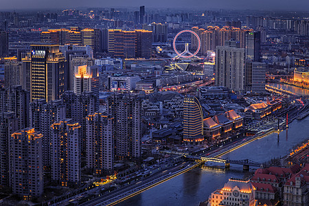夜晚的城市摩天轮背景图片