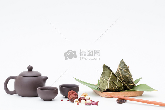 端午粽子茶壶静物白色桌面摄影图片