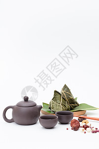 端午粽子茶壶静物白色桌面摄影图片