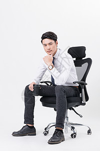 帅气时尚男士坐在椅子上高清图片