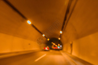 公路隧道灯光车流虚化背景图片