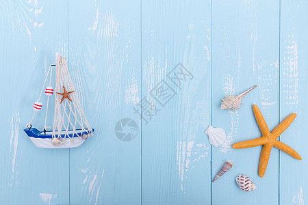 夏日蓝色木板帆船海星素材背景图片