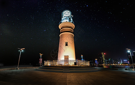 灯塔夜晚灯塔星空背景