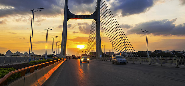汽车纹理夕阳下的桂林南洲大桥背景