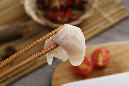筷子夹鱼肉背景