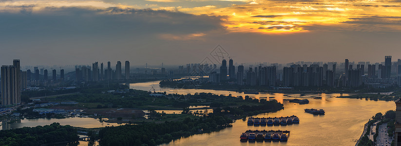 城市海滨河滨落日图片