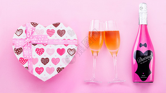 粉色质感心形礼盒高脚杯起泡酒素材背景
